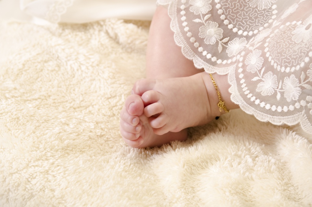 Baby feet with full moon anklet
