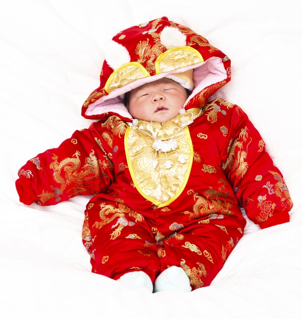 New born baby wears the Traditional Chinese attire.