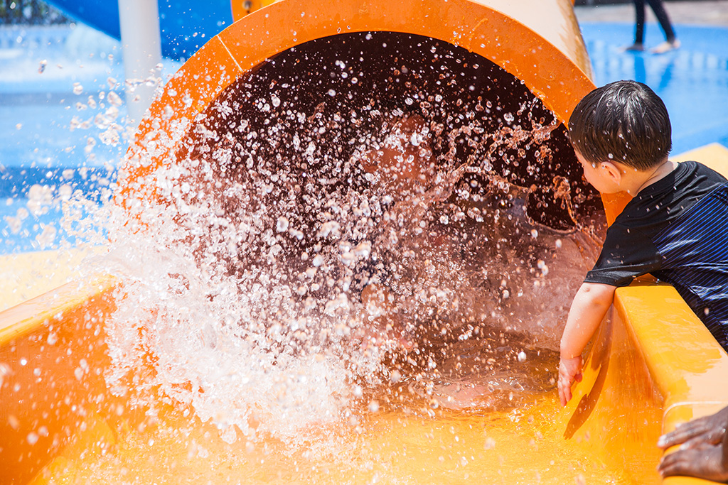 Slide down bright orange water pipes and meet new friends at the end!