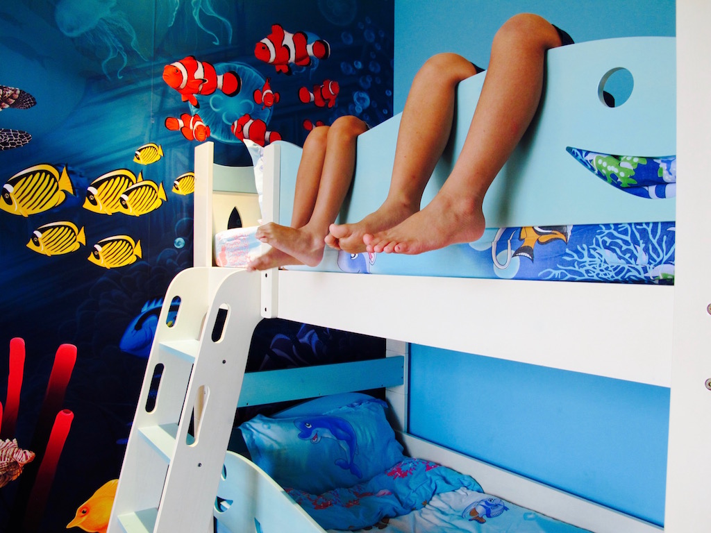 Bunk beds at D'Resort's Rainforest Aquarium-themed room