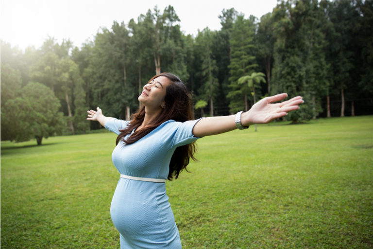 Happy Expectant Mum in a Field