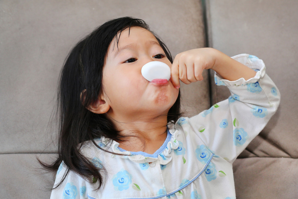 girl taking medicine