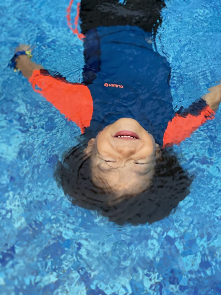 Joyful Jude floating in a pool