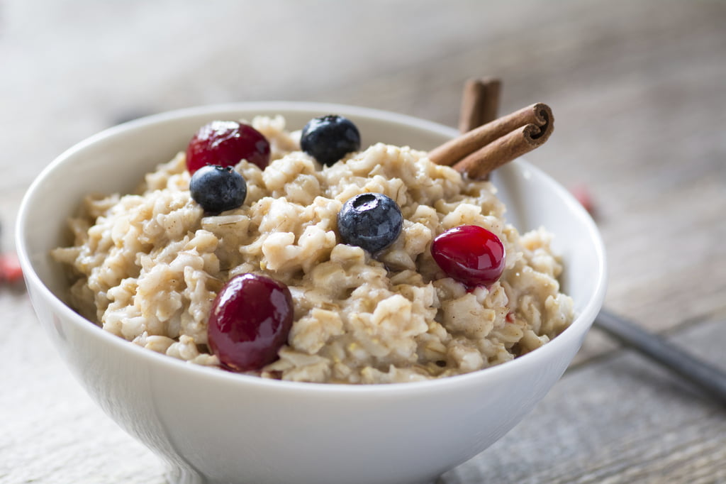 Breakfast oatmeal porridge with berries in bowl