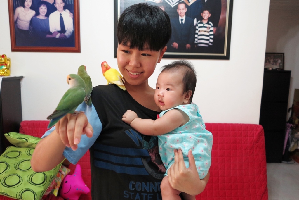Kids and pets - Kyra and lovebirds