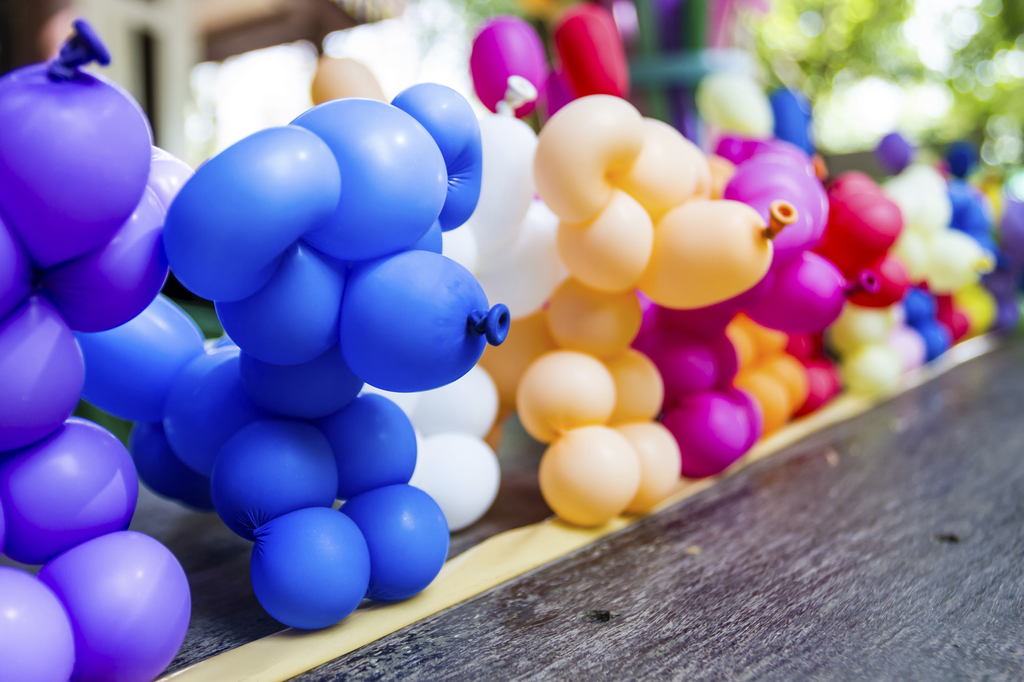 Lines of different colored balloon animals