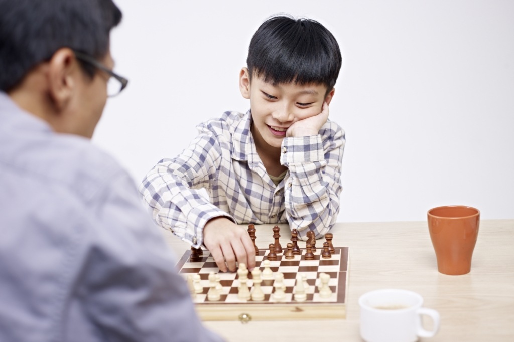 tween - playing chess with dad