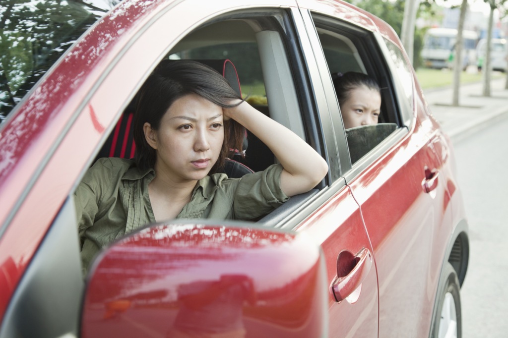kid failed maths - introspective mother and child in car
