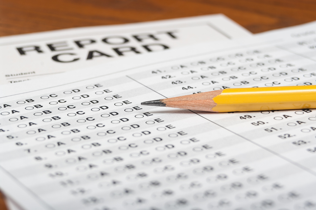 Standardized test with pencil and report card