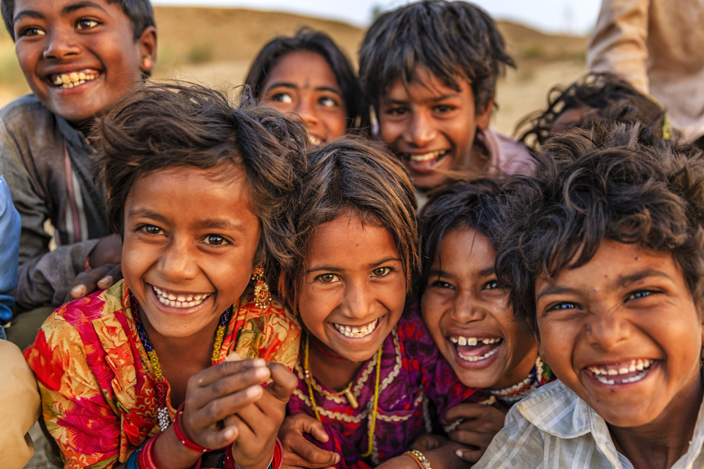 Group of happy Gypsy Indian children, desert village, India