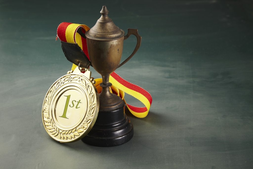 medal and trophy on the blackboard