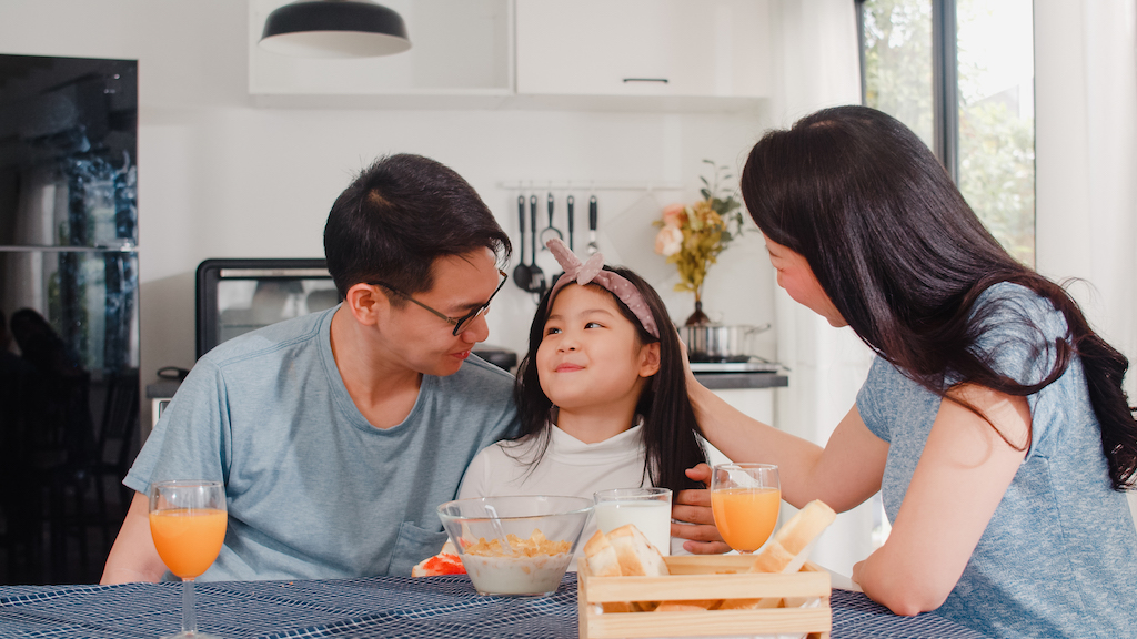 love languages - parents praising daughter at breakfast