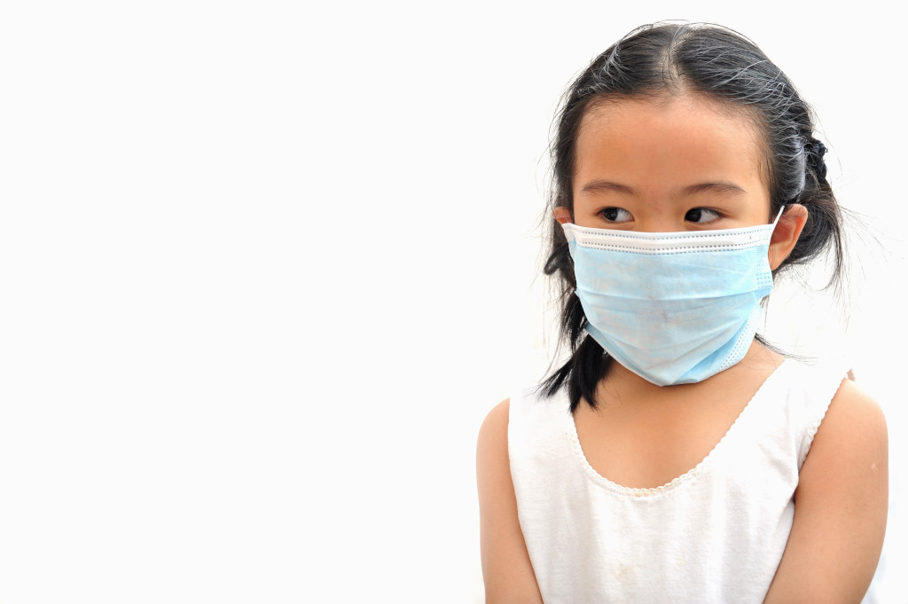 girl wearing surgical mask