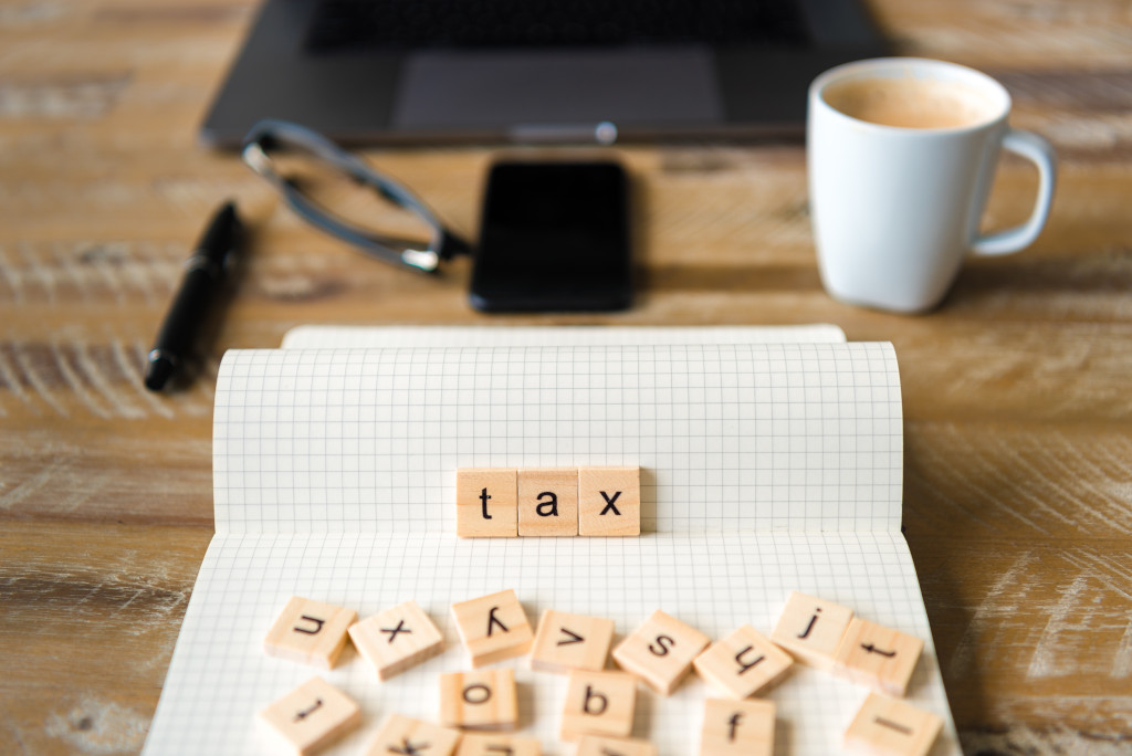 scrabble letters spelling tax