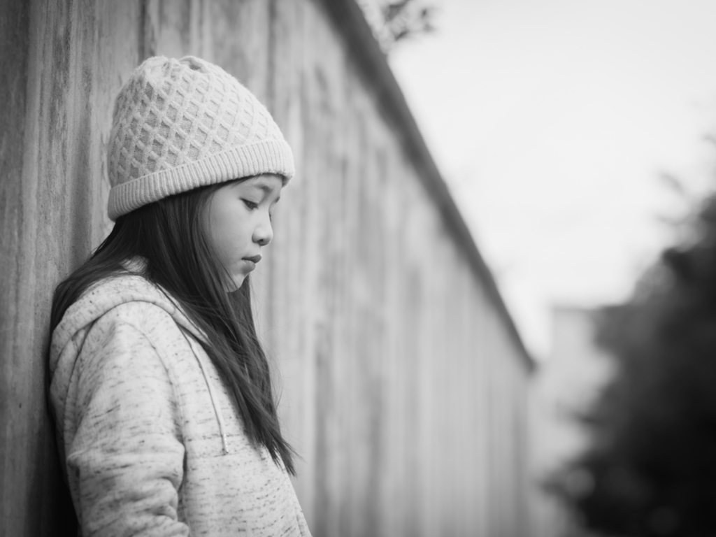 black and white photo of sad child