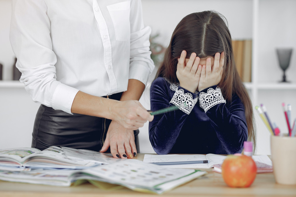 upset child and angry mother