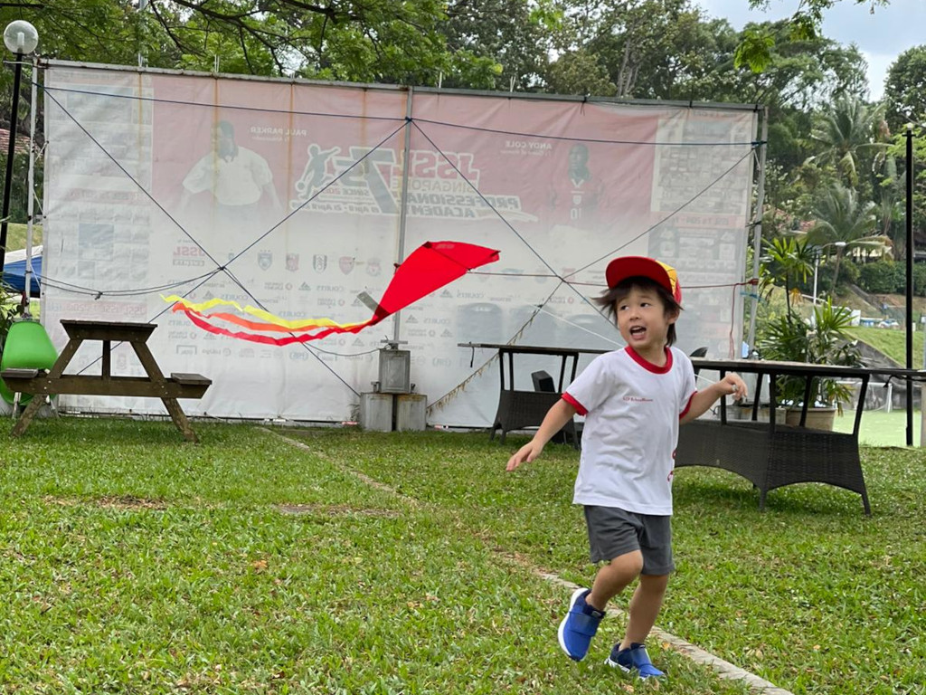 Red Schoolhouse @ PUB Recreation Club - preschooler flying kite