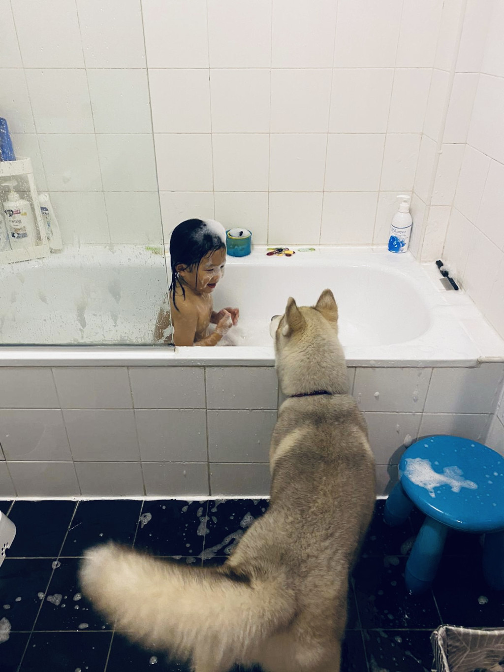 Laissez-faire parenting - Jude having a bath, with Diego the dog