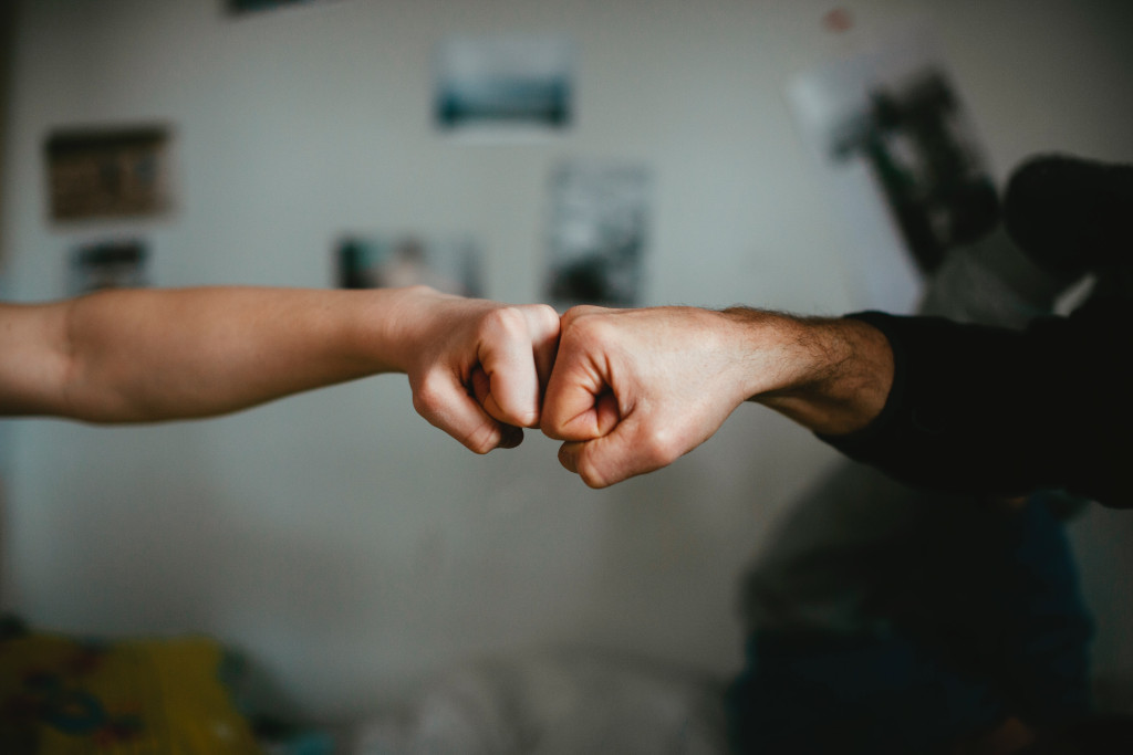 child parent fist bump