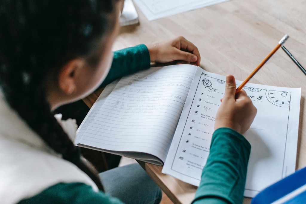 girl doing maths homework