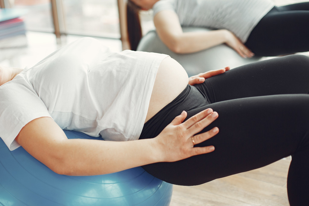 Pregnant women doing yoga