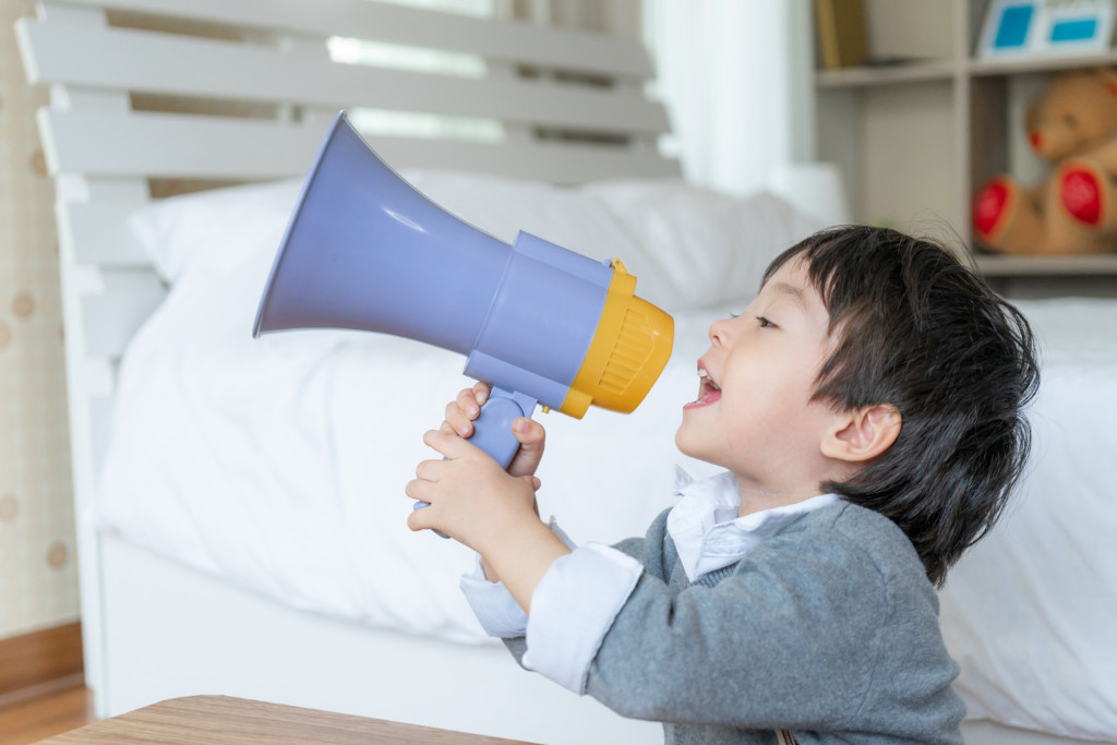 child with loudspeaker