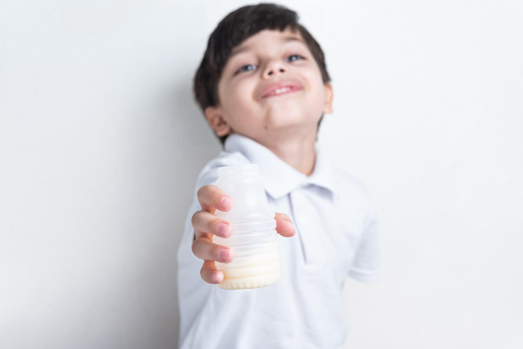 boy drinking probiotics