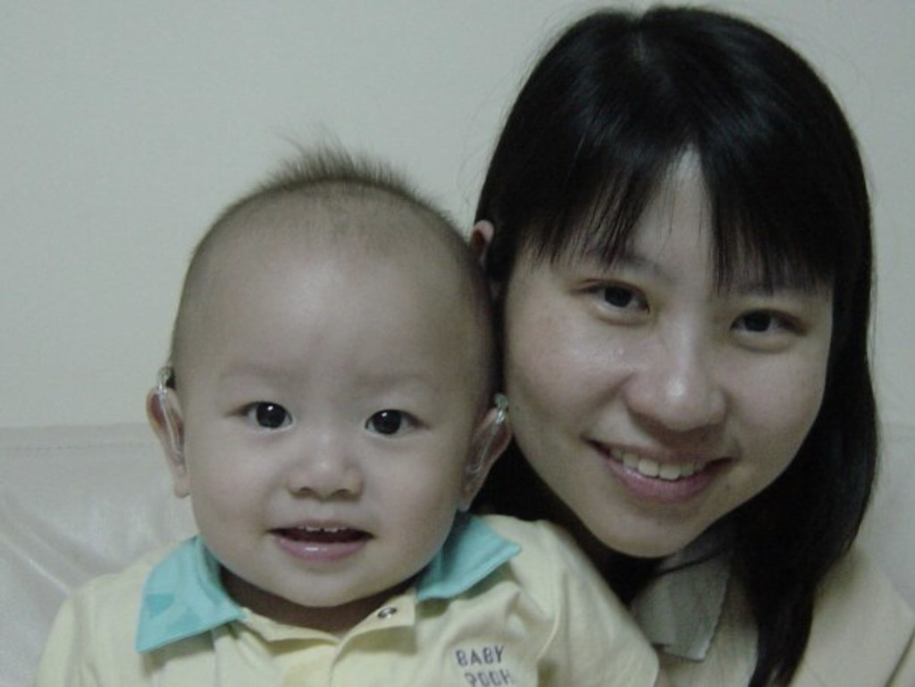 Janiz and Hon Wei with his hearing aids at 6 months