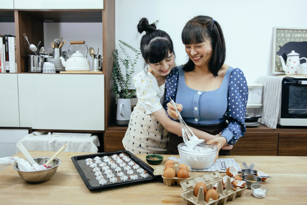mother and daughter baking happily