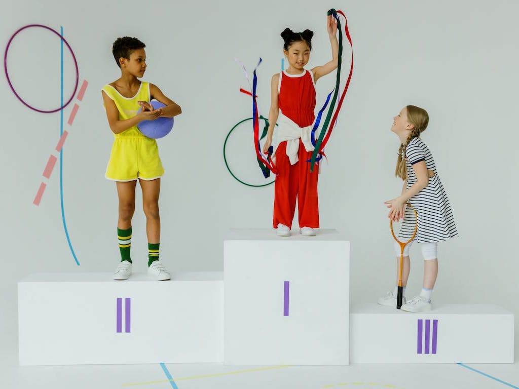 children take the podium as sports champions