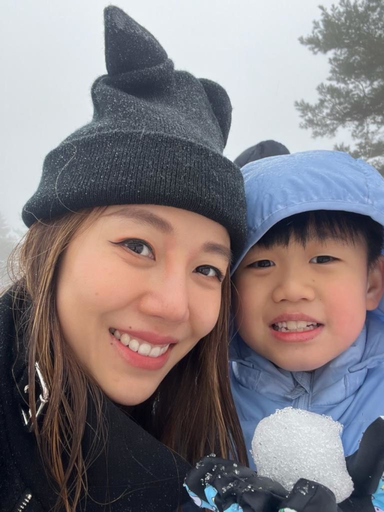 new Singapore citizen Kay Cheong with her son