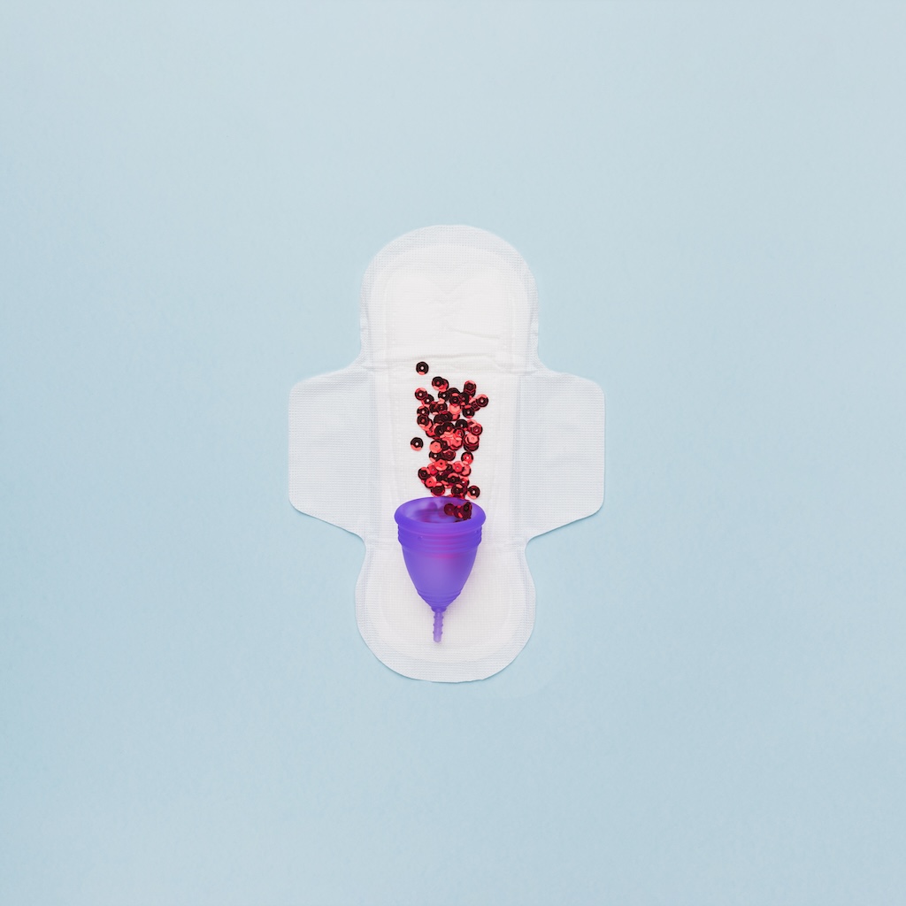 period-top-view-sanitary-towel-with-red-sequin-menstrual-cup.jpg