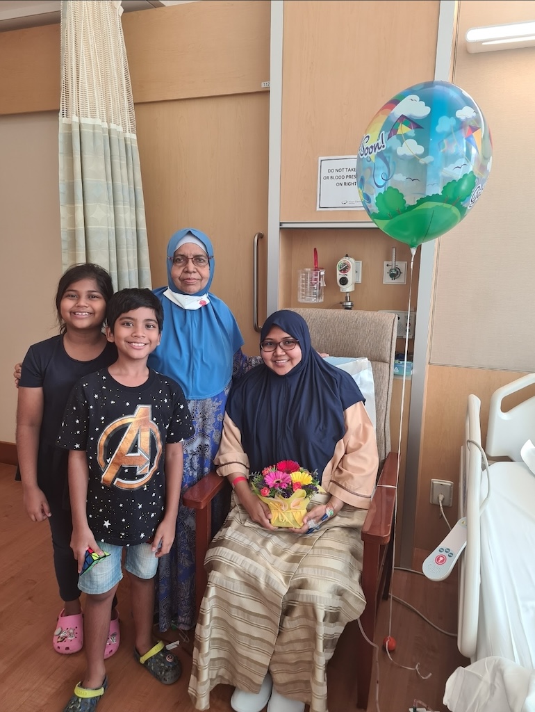 Aisha with her children and her mother-in-law, after breast cancer surgery