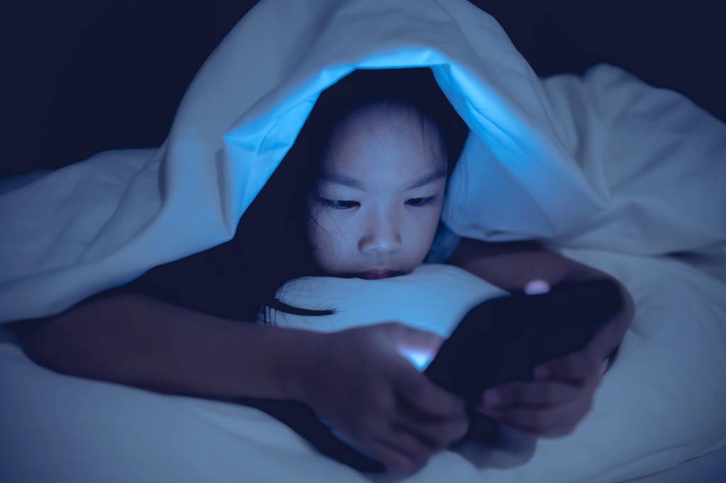 Pandora’s Box - Girl with phone in the dark