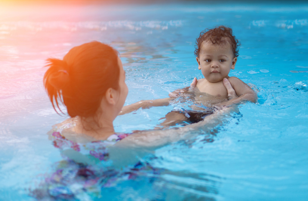 Mum and baby boy swimming