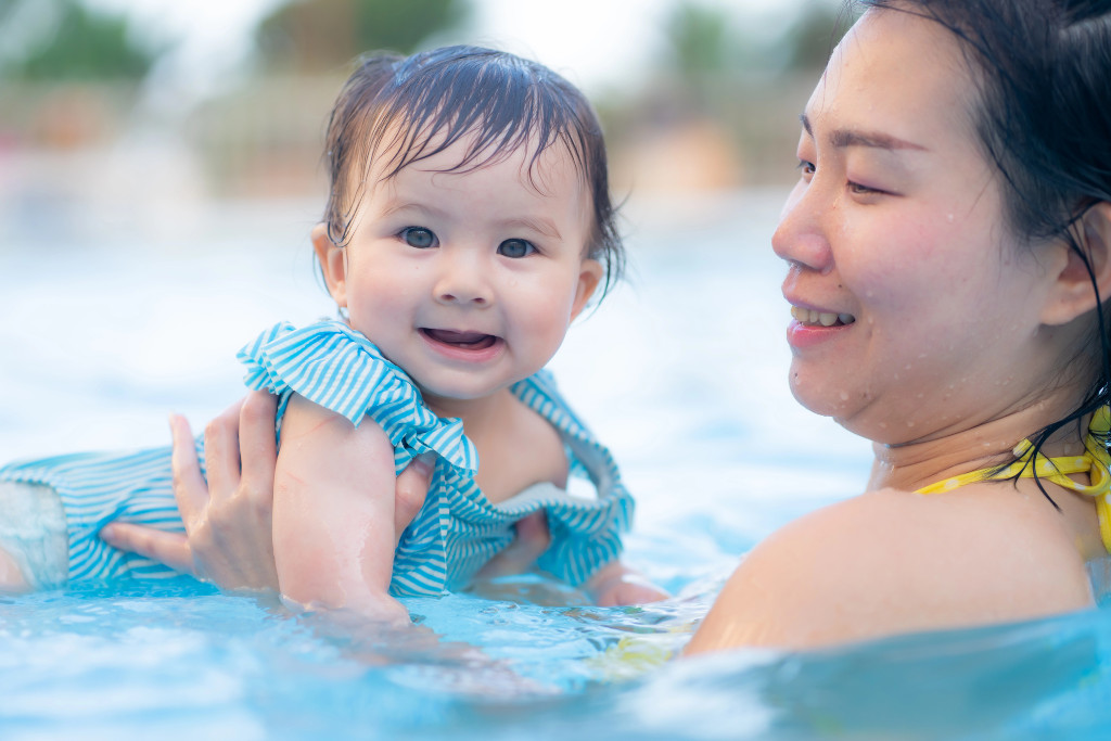 Mum and baby girl swimming