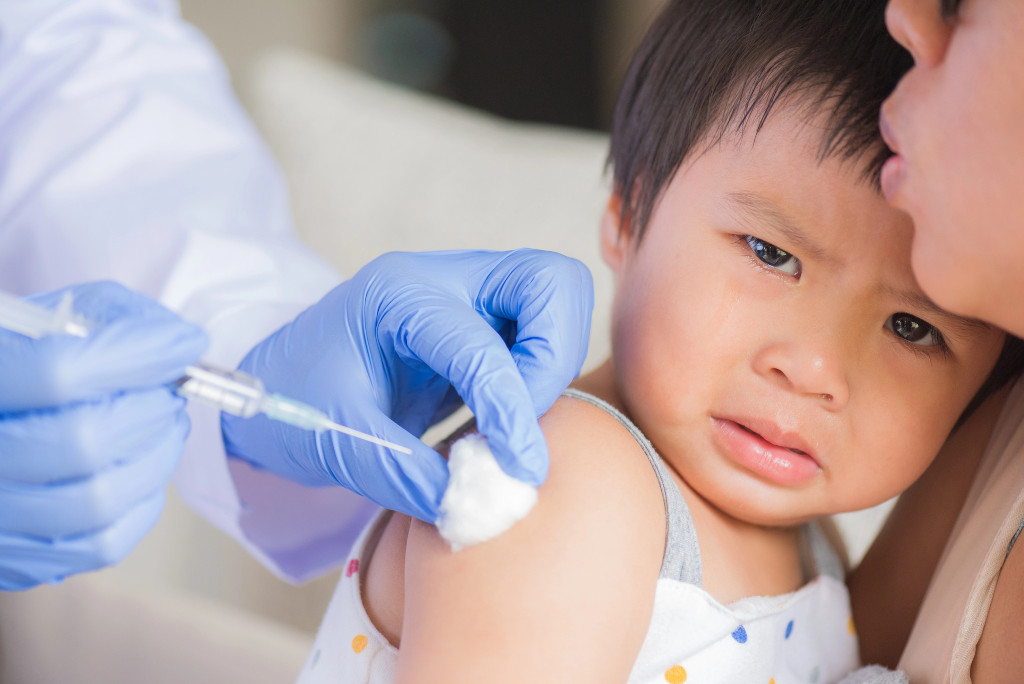 toddler getting compulsory Singapore vaccinations